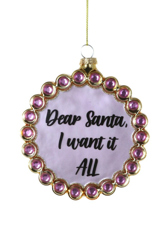 Rund glaskugle med rosa/beige perlekant og håndskrevet tekst 'Dear Santa I want it all' i midten